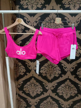 Load image into Gallery viewer, Alo Yoga XS Ambient Logo Bra - Neon Pink/White
